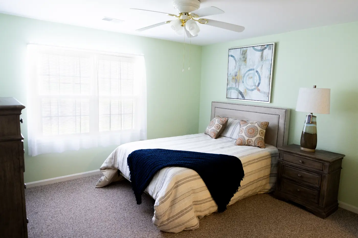 Cozy private resident room with bed and decor