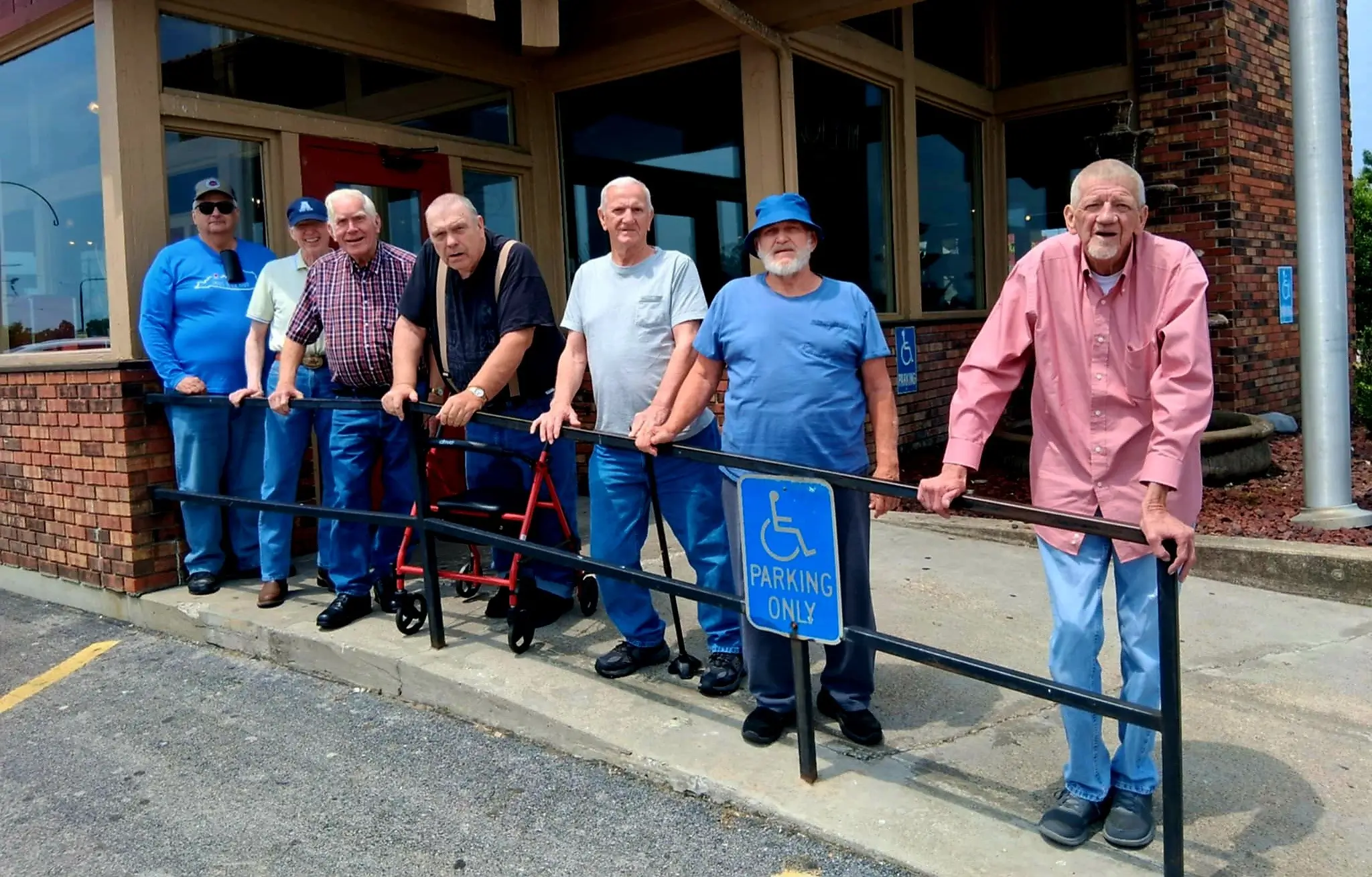 Residents standing outside the facility in a group