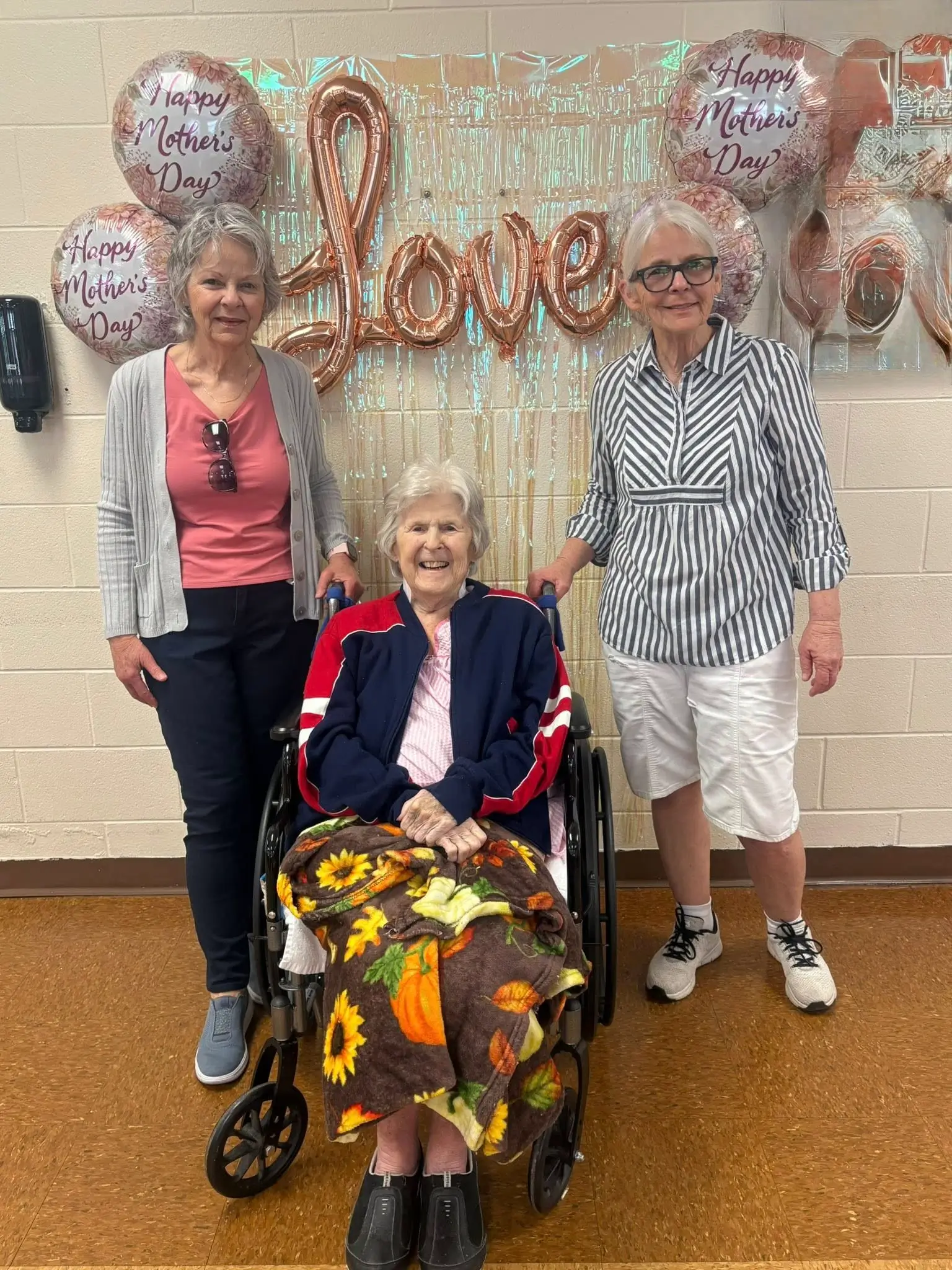 Residents celebrating Mother's Day with balloons and decorations