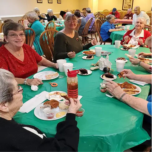 Residents enjoying a meal together in a dining area