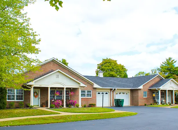 Exterior view of a senior living facility with landscaping