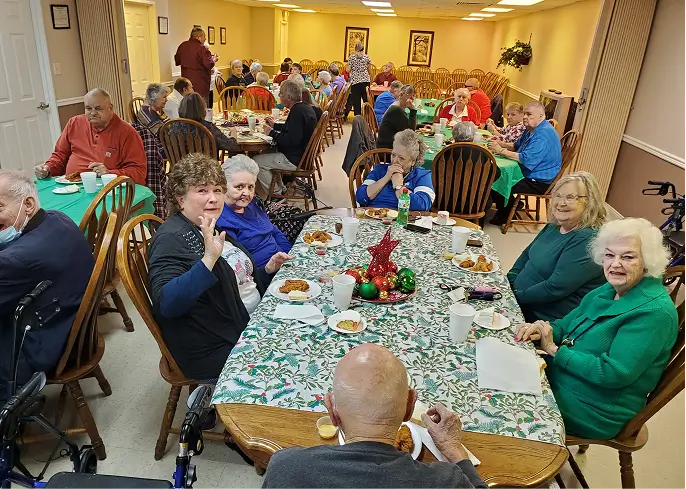 Residents enjoying a meal in the dining room