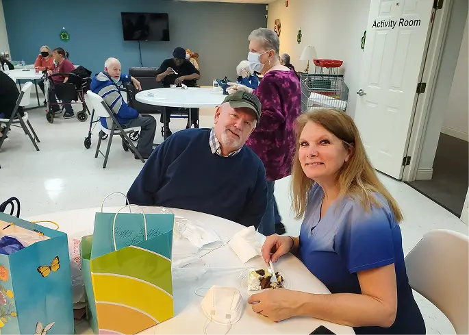 Residents enjoying dessert in an activity room