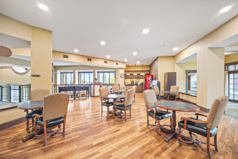 Bright common area with tables and chairs