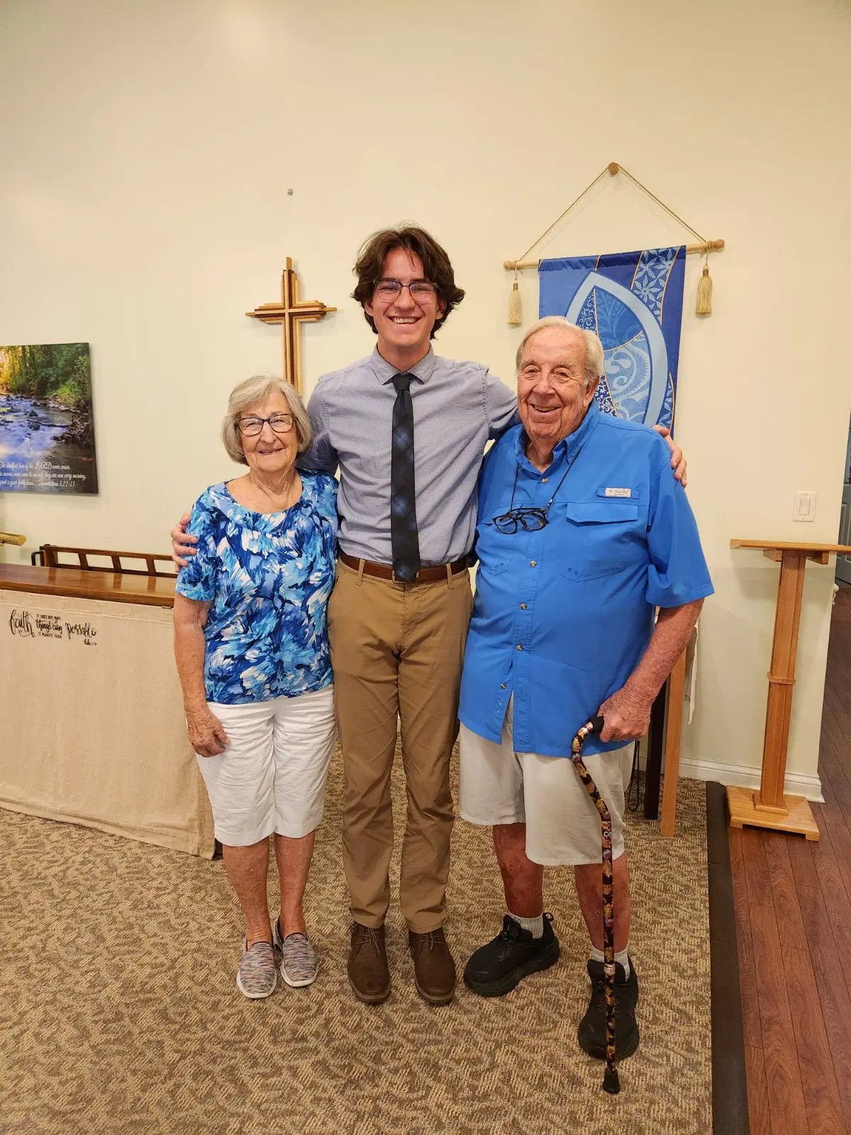 Residents with staff member in a common area