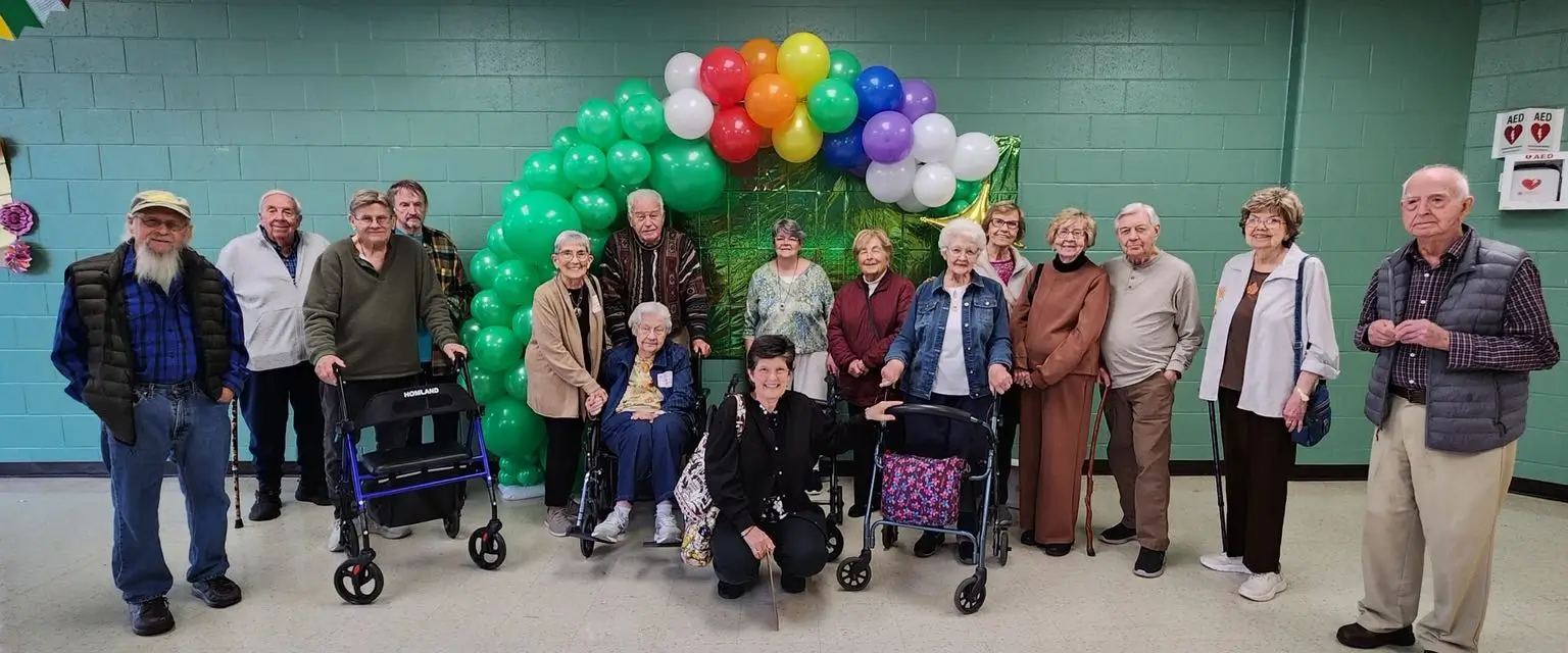 Residents posing for a group photo at a celebration