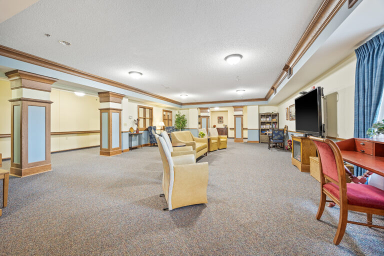 Interior common area with seating and bookshelves