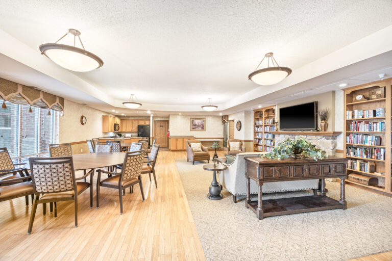 Bright common area with seating and bookshelves