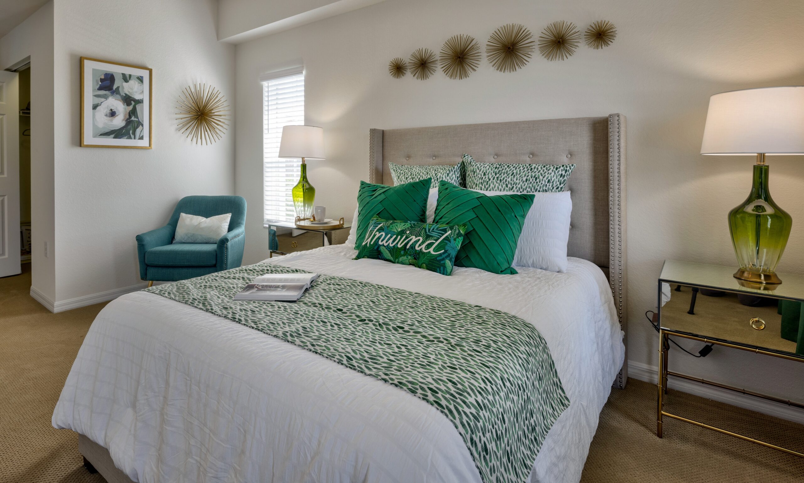 Well-decorated resident room with a cozy bed