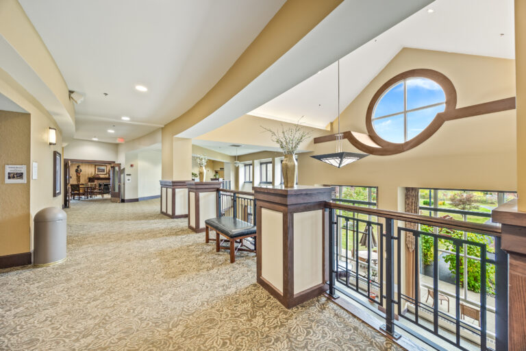 A well-lit corridor in a senior living facility
