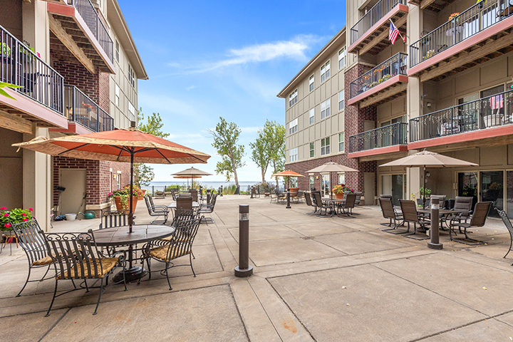 Outdoor patio area with seating and umbrellas