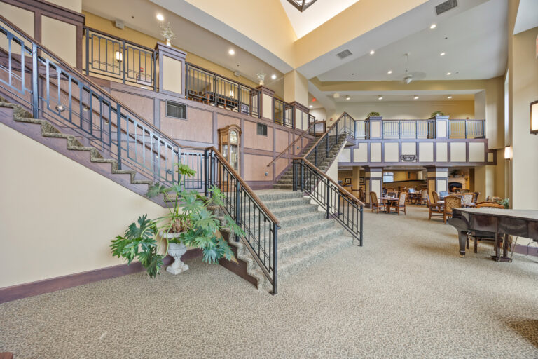 Interior view of a common area with staircases and seating