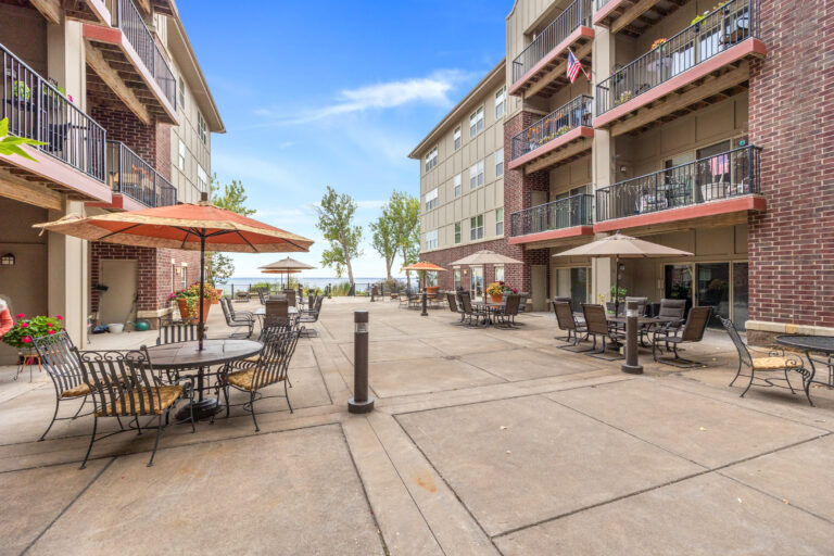 Outdoor patio area with seating and umbrellas