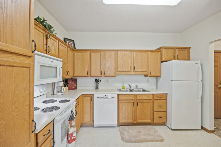 A well-equipped kitchen in a senior living apartment