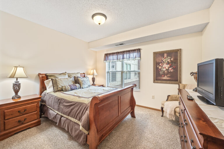 Cozy bedroom with wooden furniture and decor