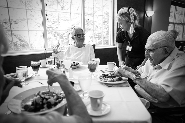 Residents enjoying a meal in the dining room