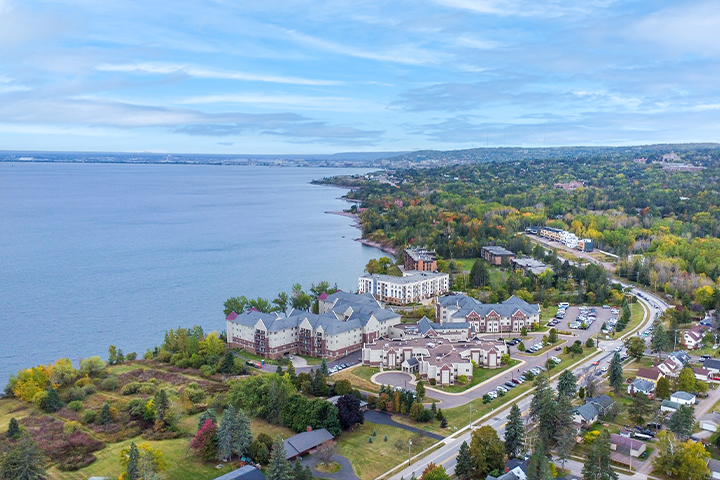Aerial view of a senior living campus by the lake