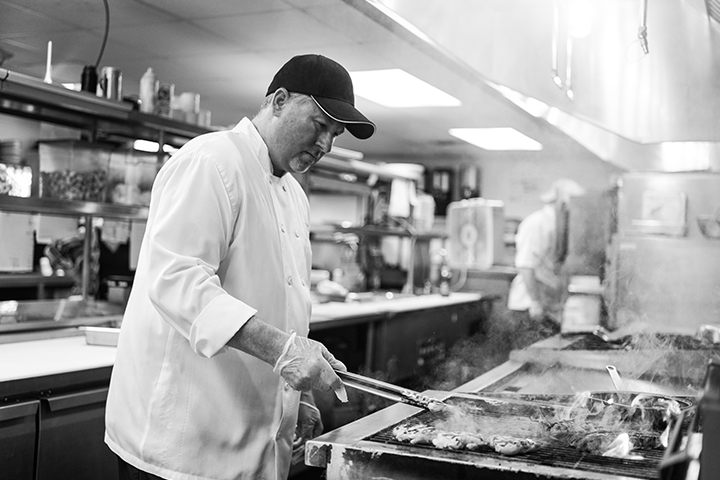 Chef preparing food in a facility kitchen