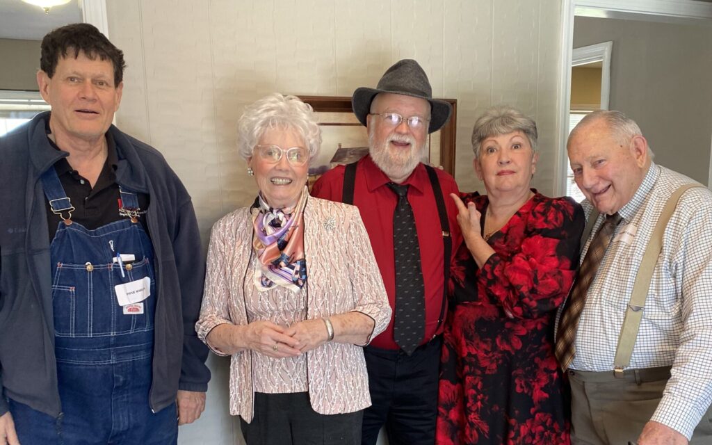 Group of residents smiling in a common area