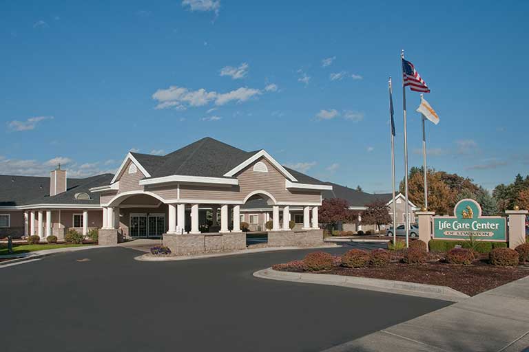 Exterior view of the Life Care Center building with flags