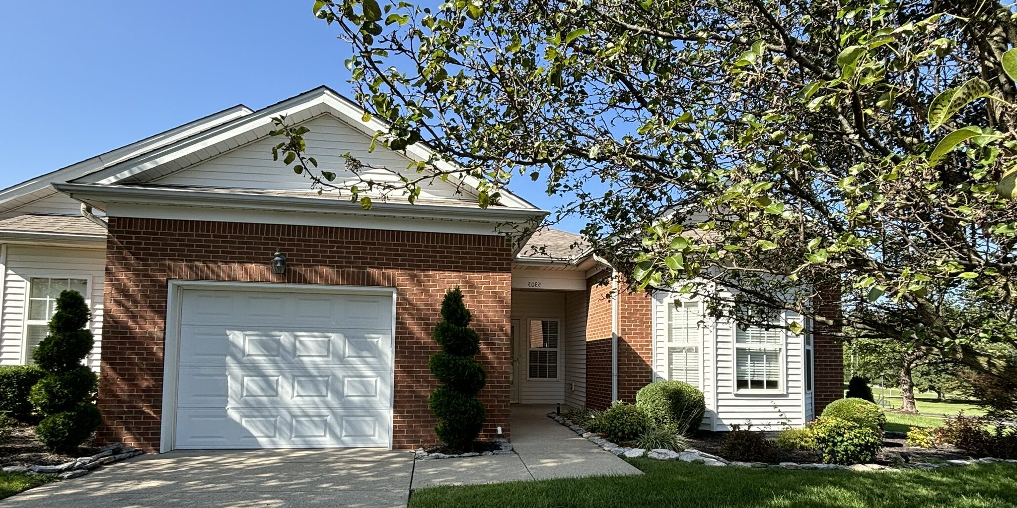 Facade of a brick building with landscaping