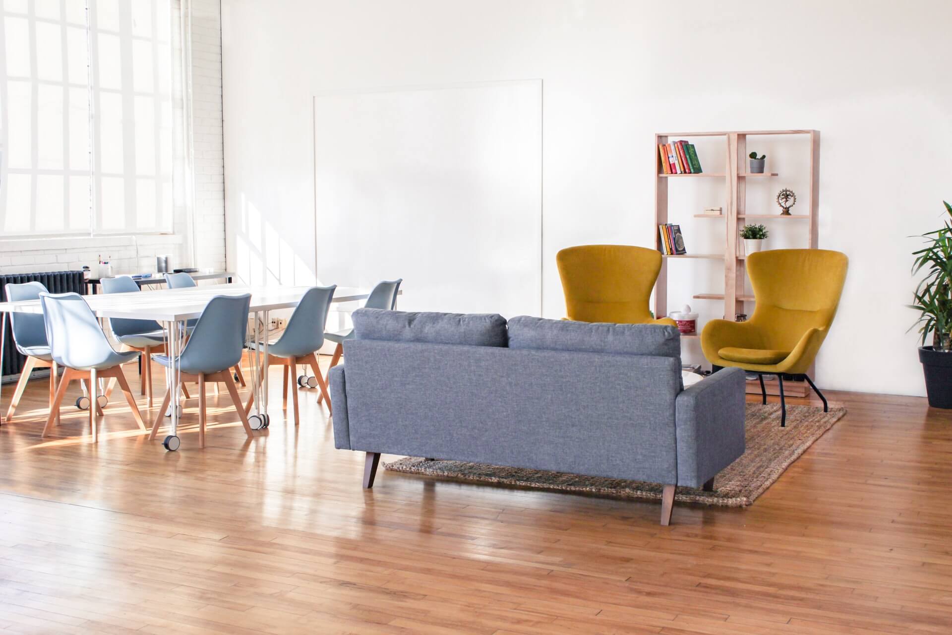 Bright common area with seating and dining space