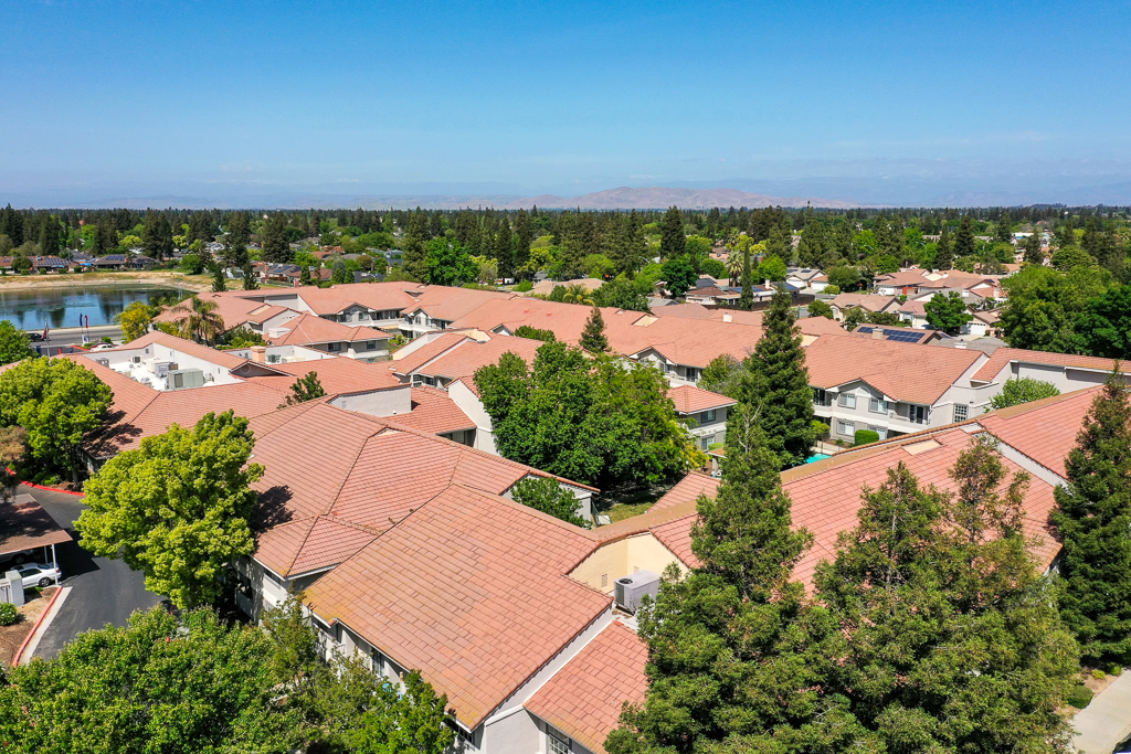 Aerial view of a senior living community with homes and green spaces
