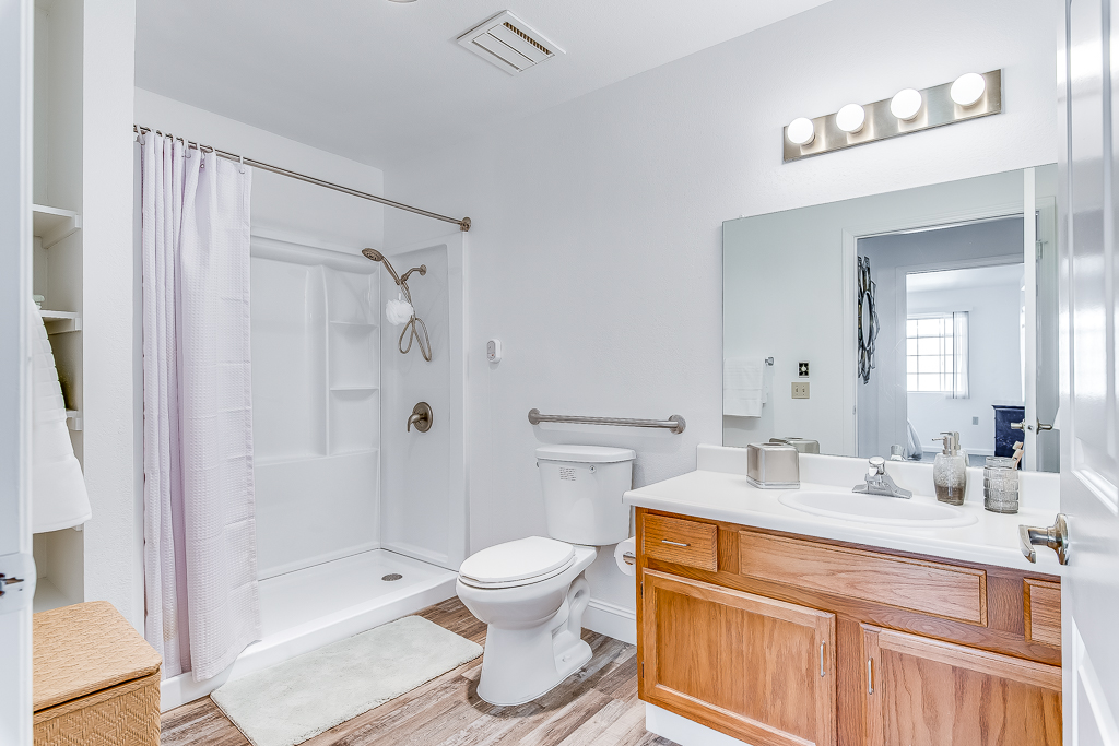 Bright bathroom with modern fixtures and lighting