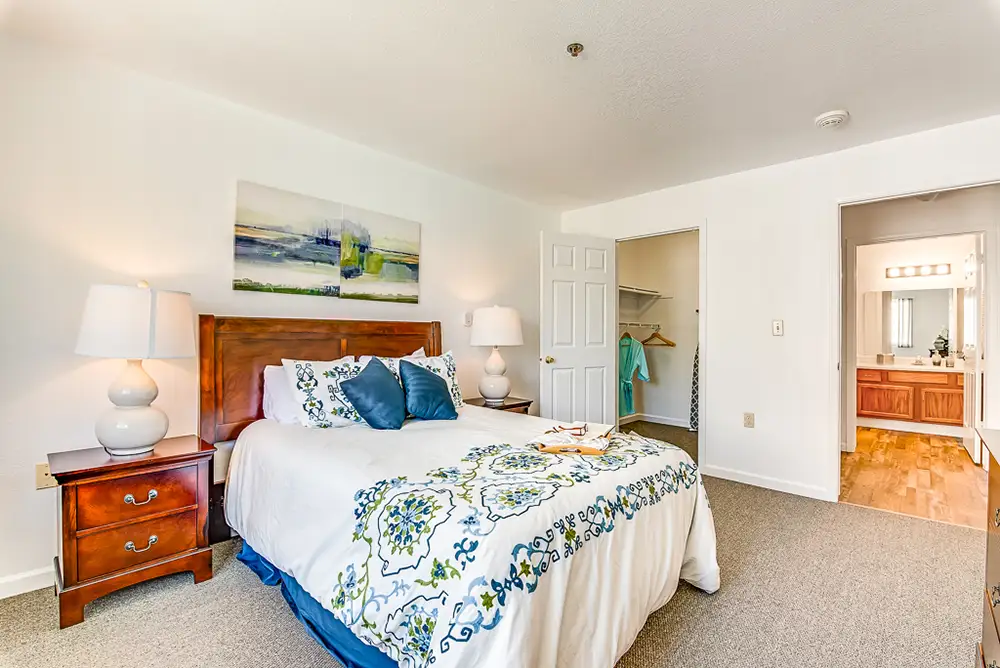 Cozy bedroom setup with modern decor and en-suite bathroom