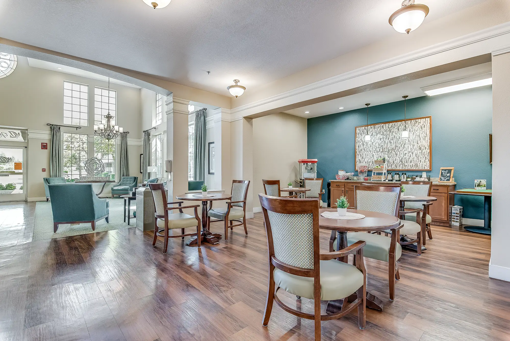 Bright and inviting common area with tables and seating