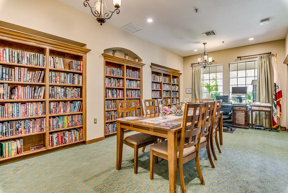 Cozy common area with bookshelves and dining table