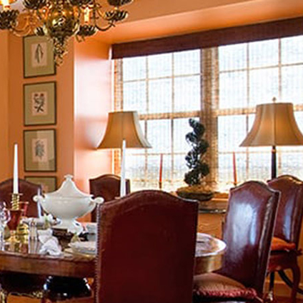 Elegant dining room with a round table and decorative lamps