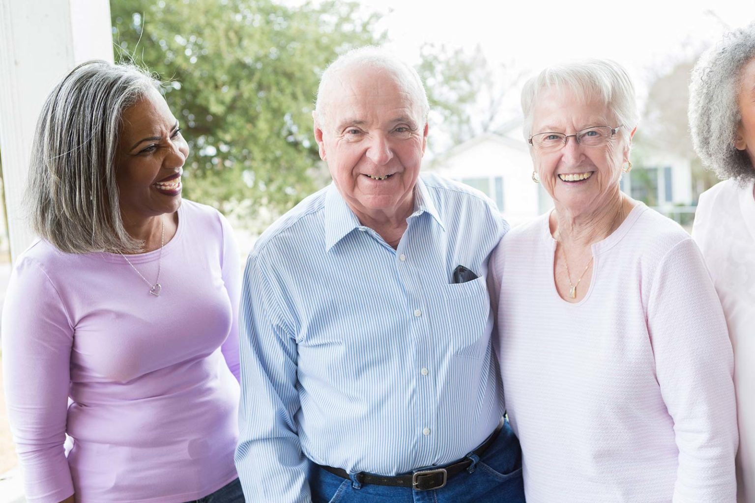 Three seniors smiling and enjoying each other's company