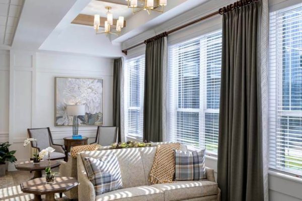 Bright common area with comfortable seating and large windows