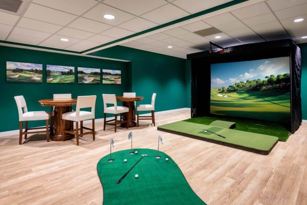 Indoor golf simulation area with putting green