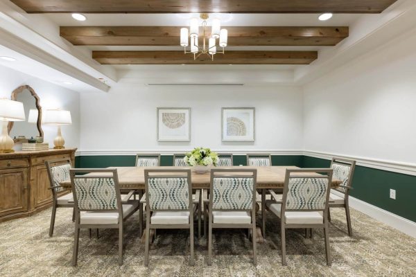 Dining room with a large table and decorative fixtures