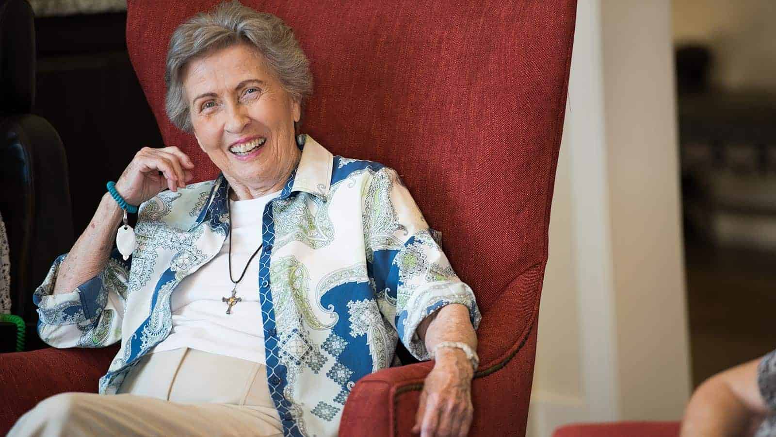 Resident enjoying a moment in a cozy chair