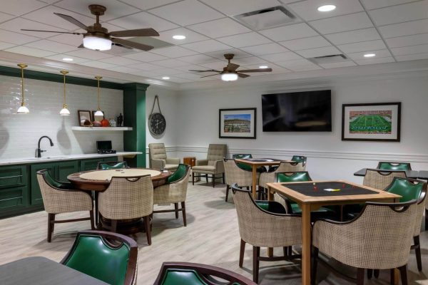 Bright common area with seating and tables