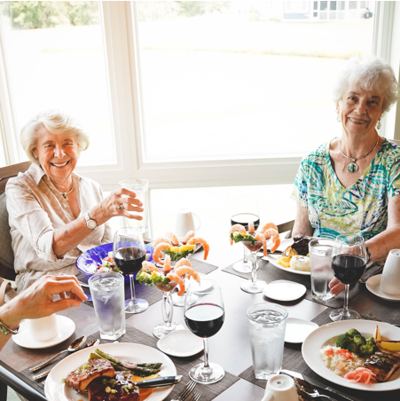 Residents enjoying a meal in the dining room