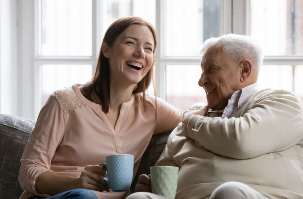 Smiling residents enjoying tea and conversation