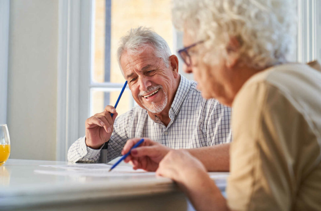 Two residents engaging in an activity at a table