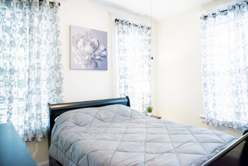 A well-furnished private bedroom in a nursing home