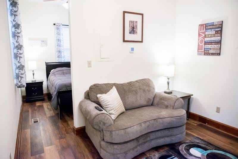 Cozy interior of a resident's room with a couch and lamp