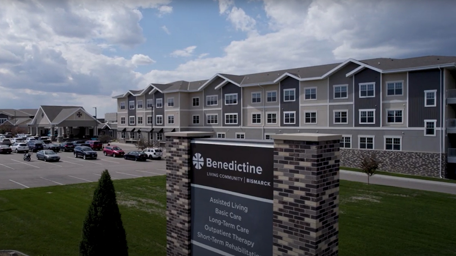 Exterior view of Benedictine Living Community-Bismarck sign and building
