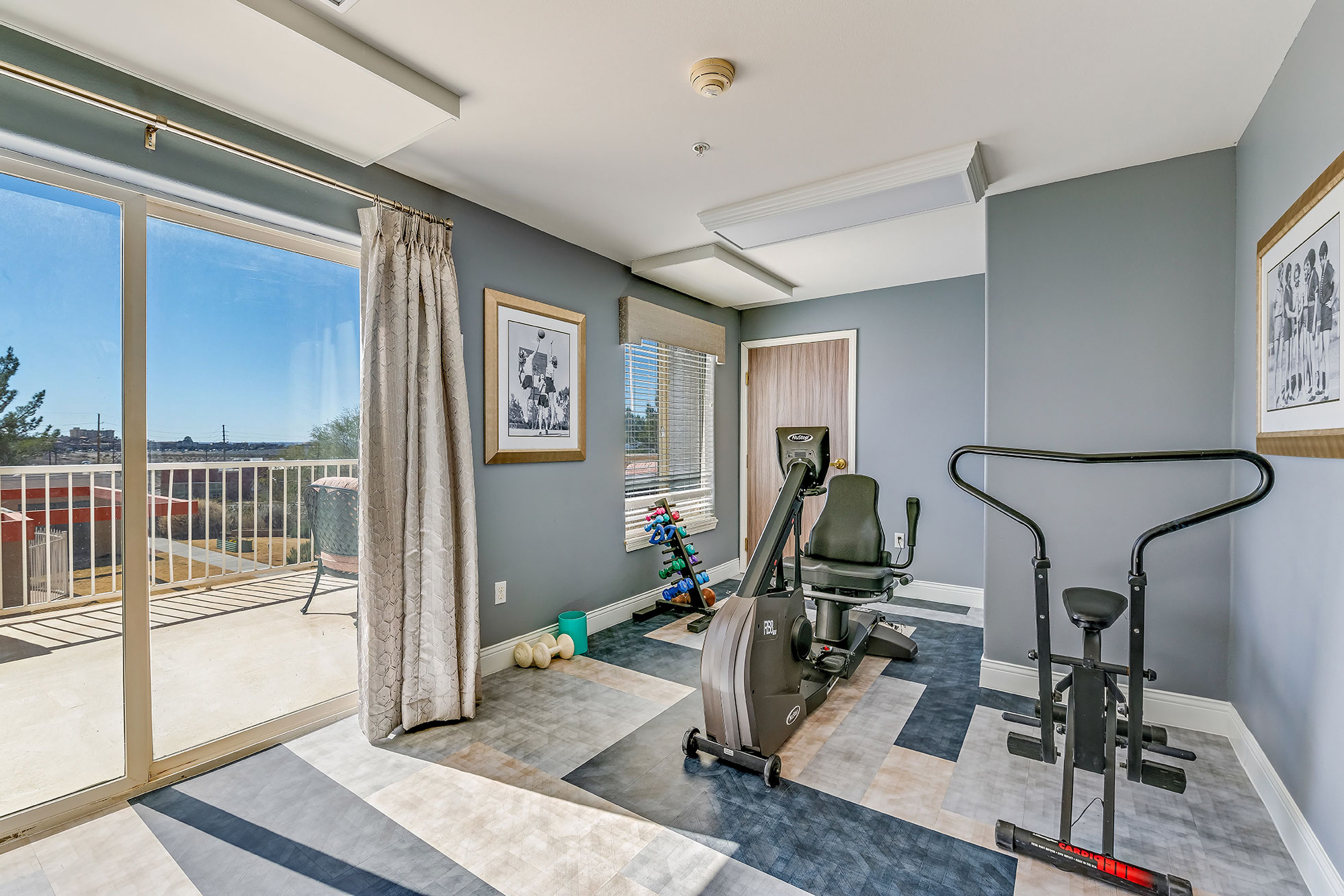 Fitness area with exercise equipment and natural light