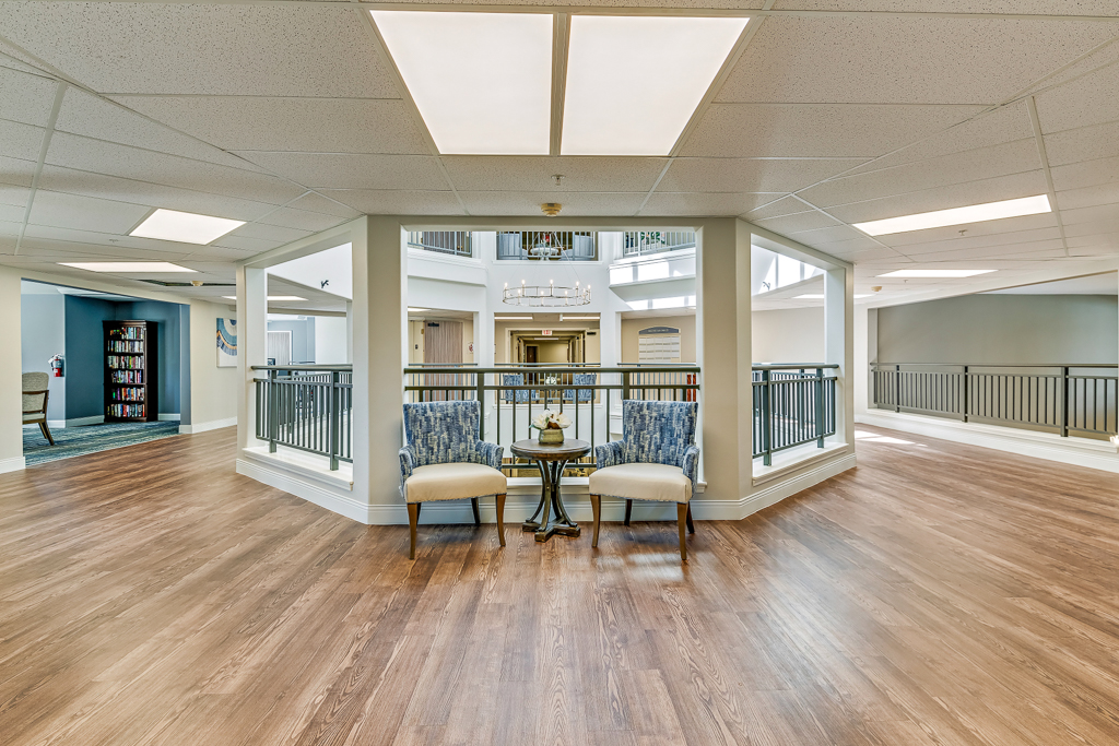 Well-lit common area with seating and decor