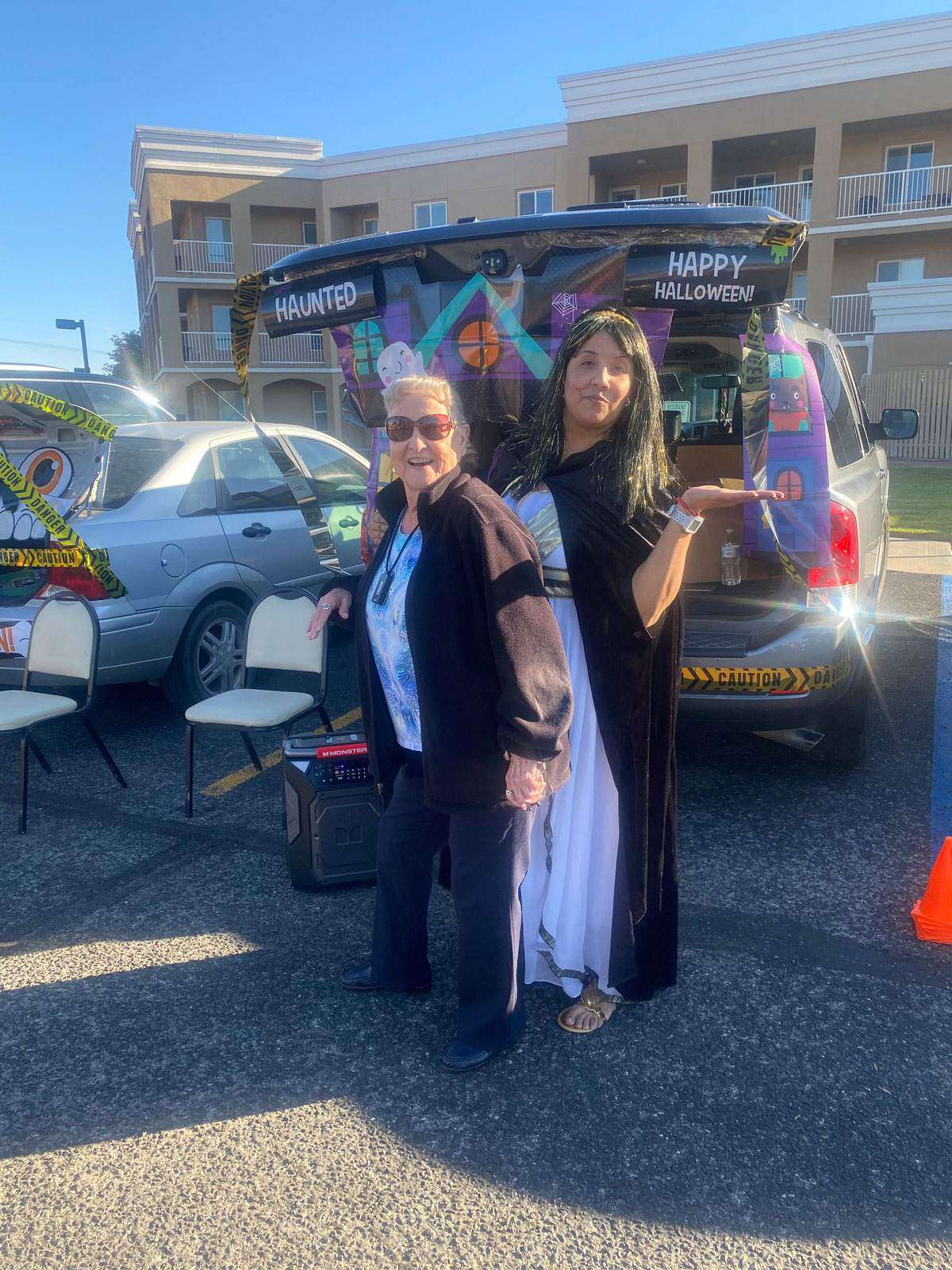 Residents celebrating Halloween at an outdoor event.