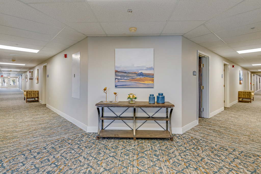Interior hallway with decor and seating area.