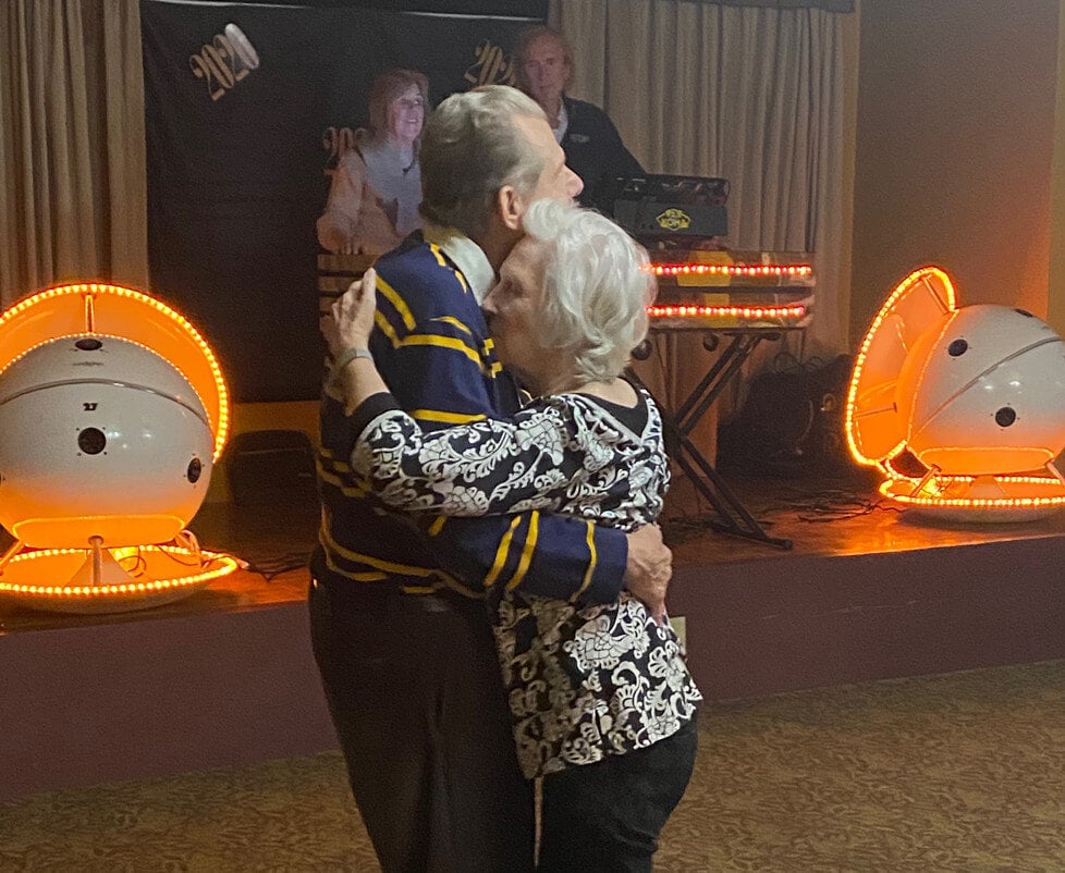 Couple dancing at a celebration in the facility