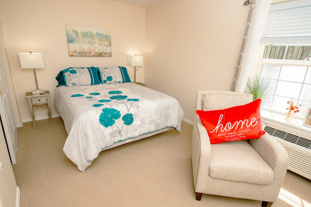 Comfortable resident bedroom with homey decor.